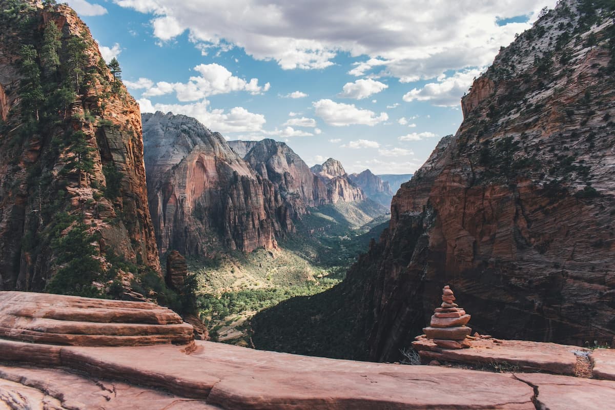 View from Angel's Landing hike in Zion National Park with large canyons and red rock formations in background