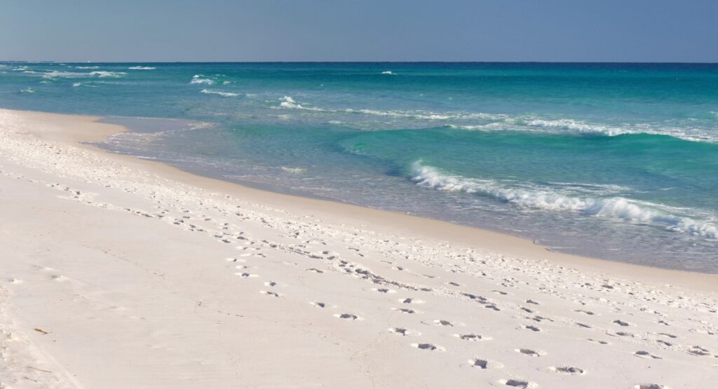 White sand beach with turquoise Gulf of Mexico waters at Henderson Beach State Park in Destin Florida popular beachfront RV camping destination