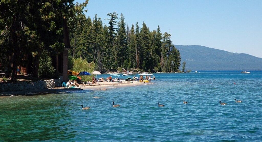 People relaxing on the shore at Sugar Pine Point State Park, Lake Tahoe